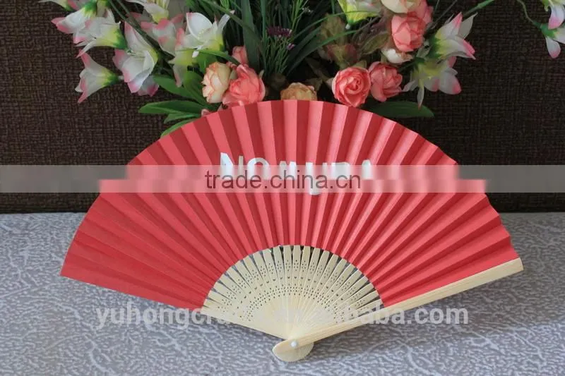 Red hand paper fan made from Zhejiang China