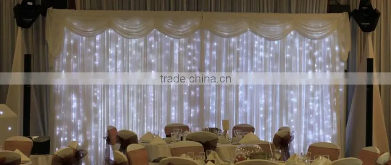 fancy and elegant pipe and drape wedding backdrop