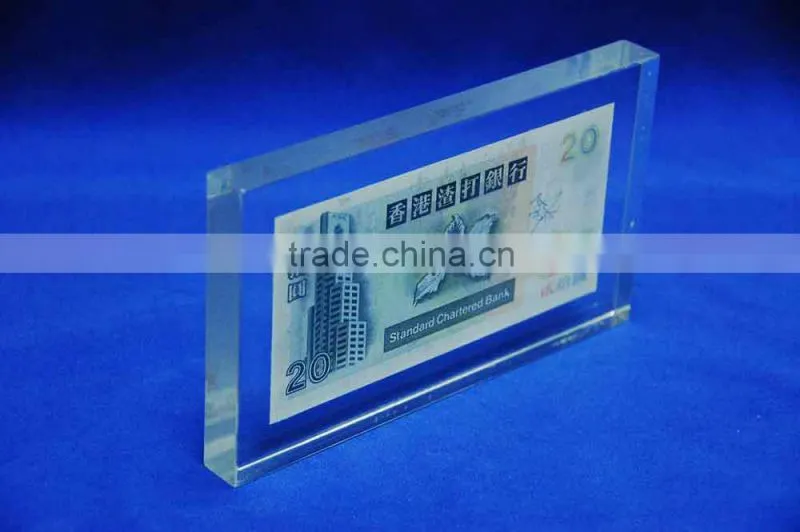 transparent plastic acrylic logo block with money