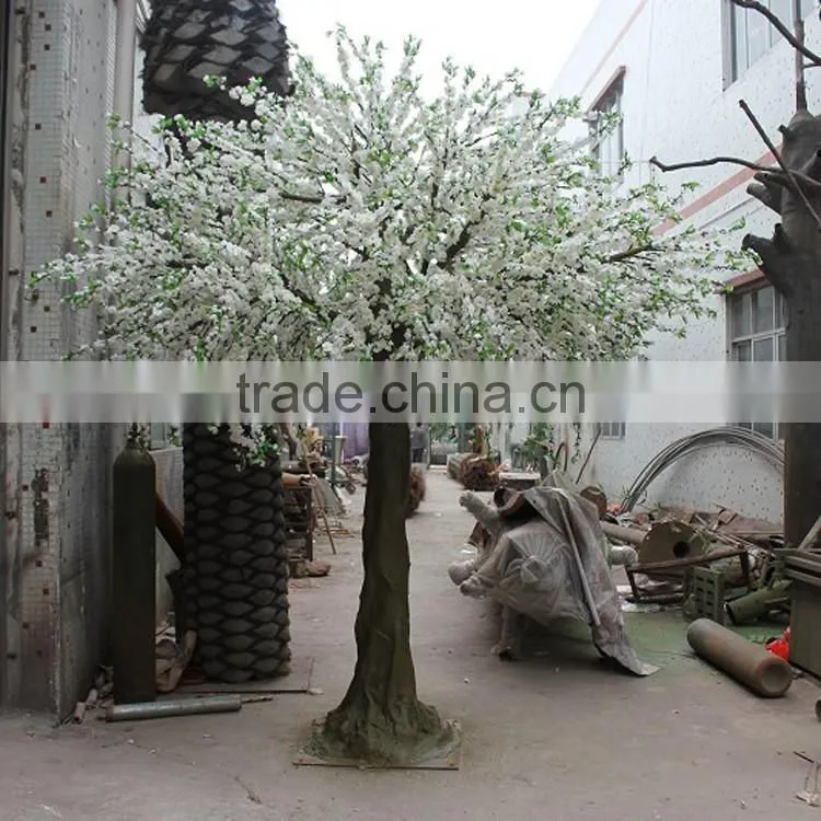 Pink artificial cherry blossom trees with rotating base
