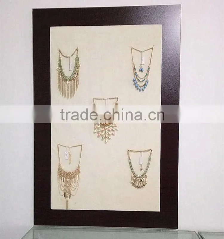 Graceful golden metal strips with handmade braids dangle earring