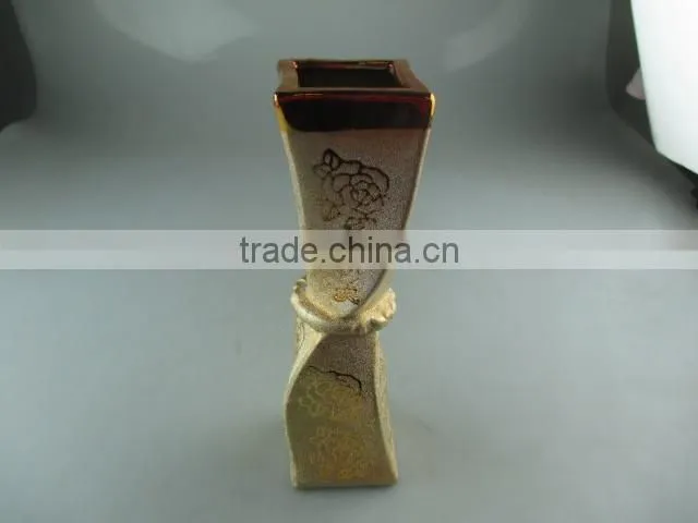 beautiul golden porcelain type vase with flower design