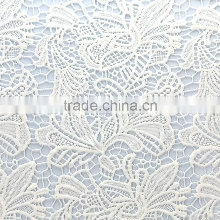 Guangzhou factory supply embroidered moisture and cool white cutwork embroidery fabric for dress