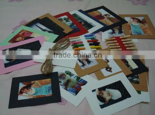 Recyclable paper picture photo frames hanging over at the rope with wood clamp