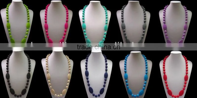 Turqoise silicone teething necklace for mom to wear and baby to enjoy