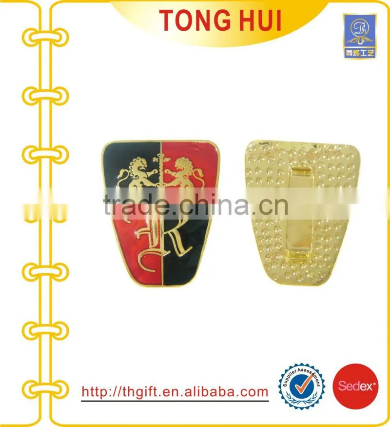 Metal badges with fan-shaped design