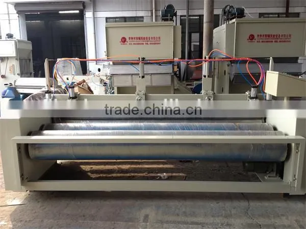 Slitting and rewinding machine, fabric slitting and rewinding machine