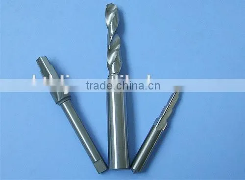 Solid step tungsten carbide tipped drill bits for hardened steel