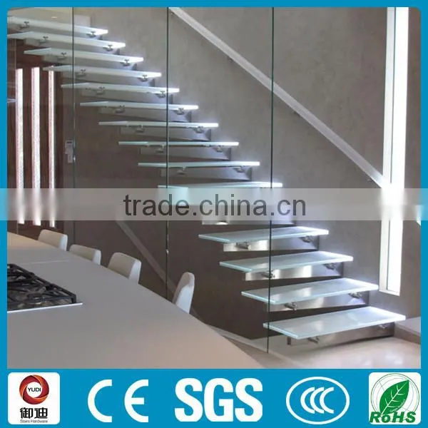 fabulous floating staircase with thick glass railing.