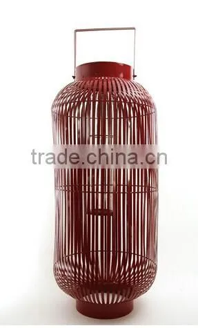 large metal lantern with clear glass cylinder