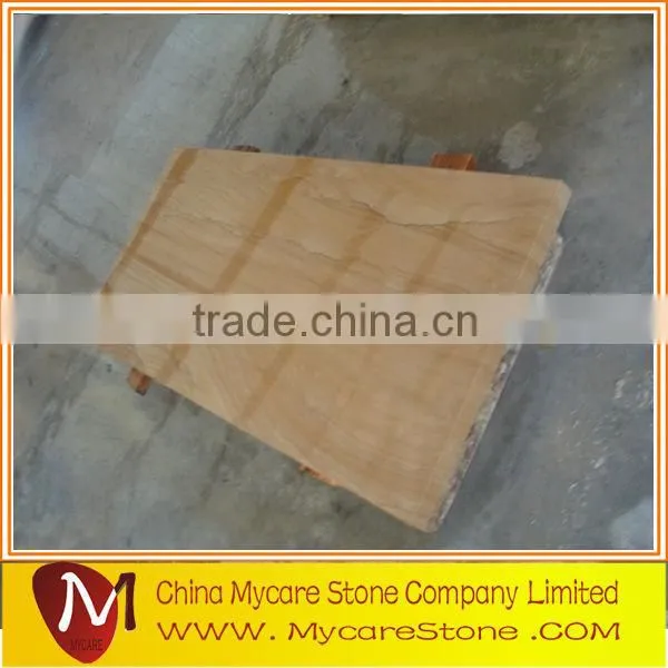 Polished sandstone paving