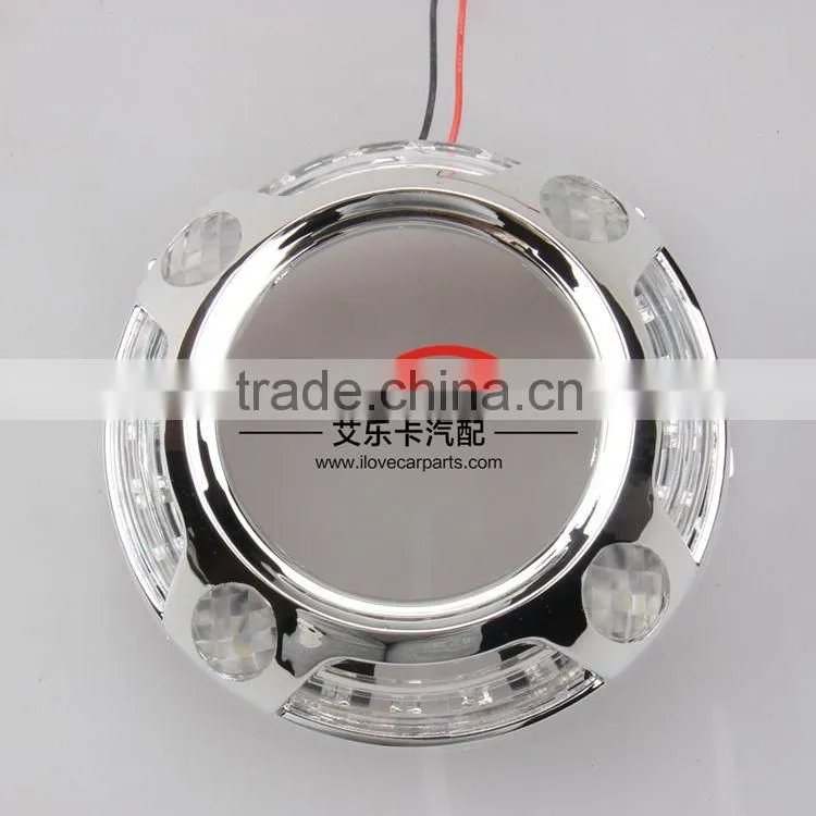 Auto headlamp shroud with led-light-guide angle eyes
