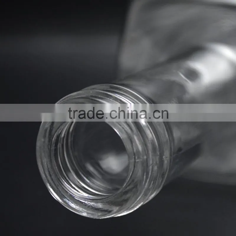 Whiskey bottle in glass with aluminum cap
