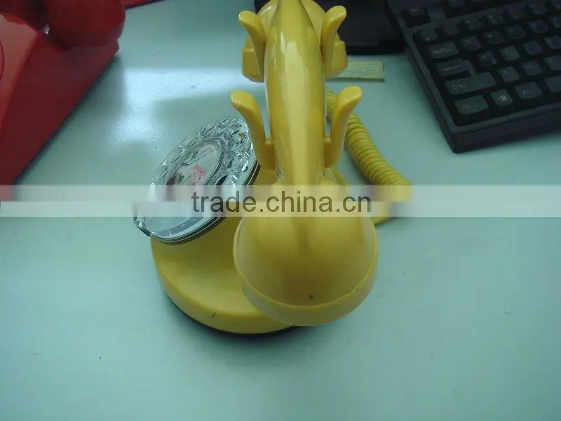 Yellow Rotary dial telephone