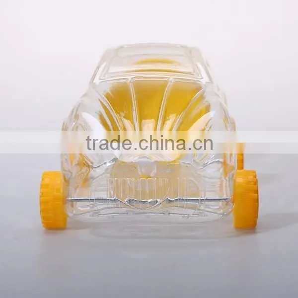 Small cute clear plastic bottles in toy shaped for candy