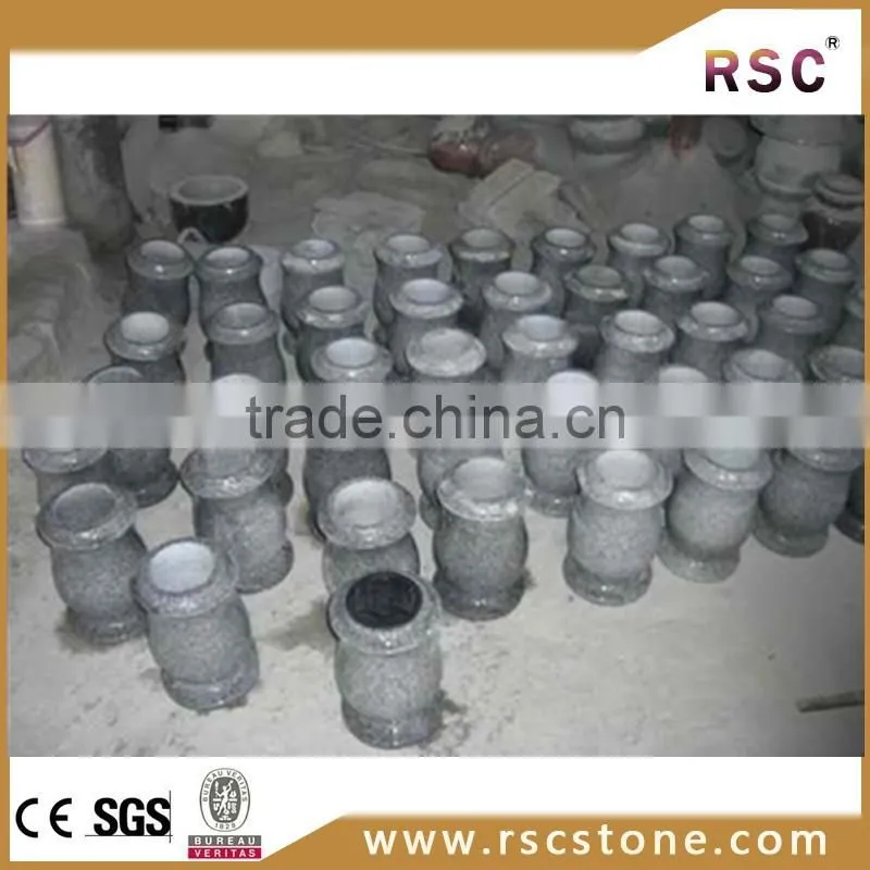Small black round tombstone