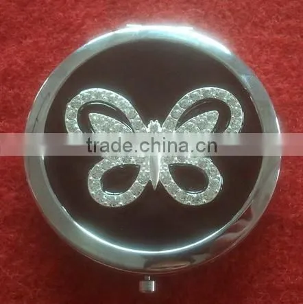 black handmade compact mirror with metal octopus decor