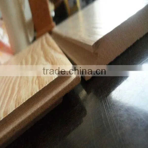 Hand grasps laminated floor