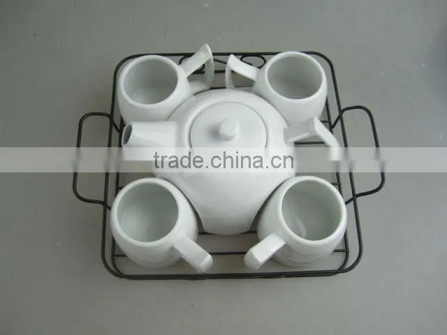 white porcelain tea set with metal stand