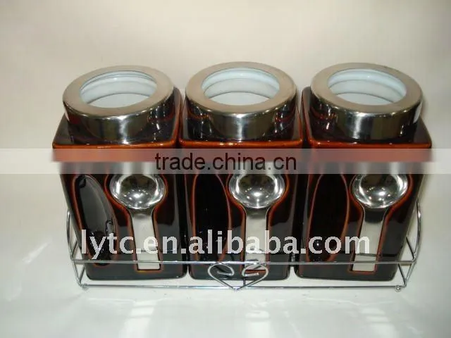 ceramic canister with metal spoon and lid