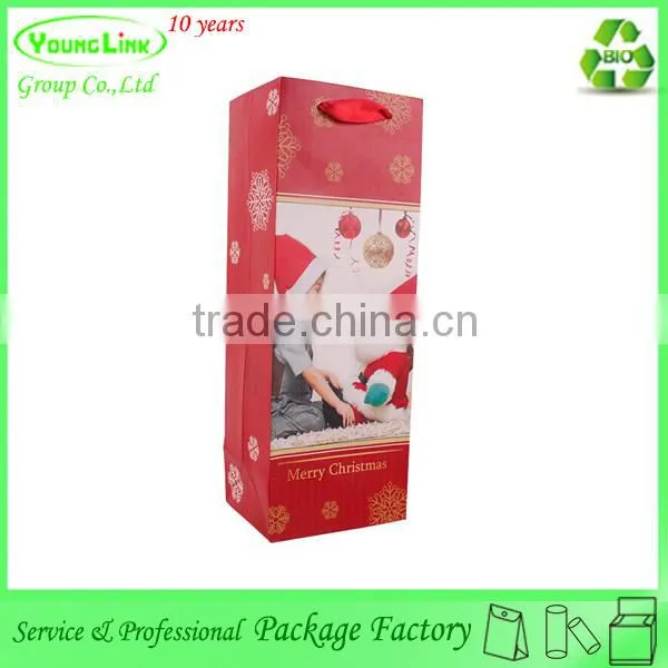 Adorable child toy christmas paper bag with ribbon