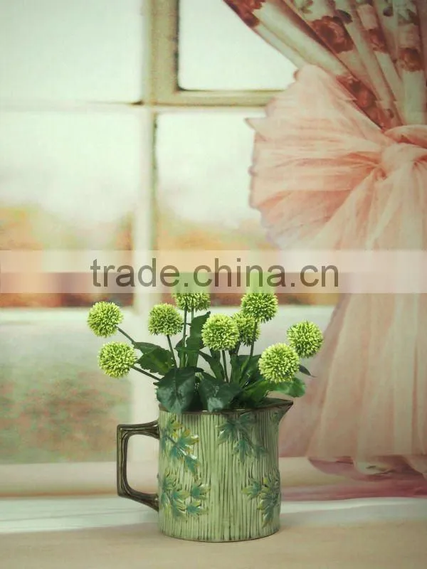ceramic handle vase with flower design