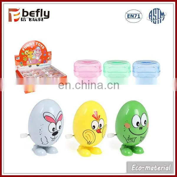 Novelty toy plastic wind-up chick in capsule