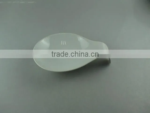 white porcelain dish with spoon shape