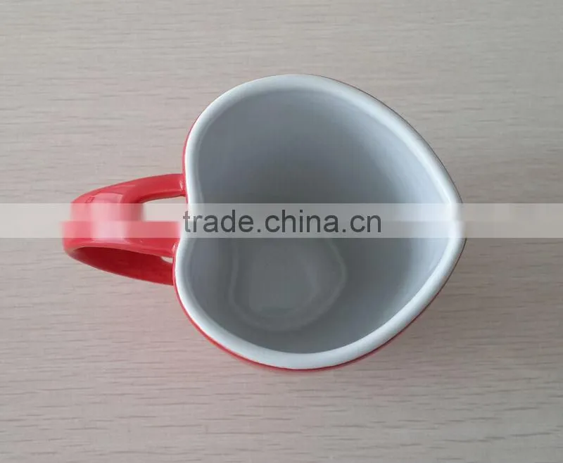 Factory bulk sale gift ceramic heart shape mug with spoon in handle