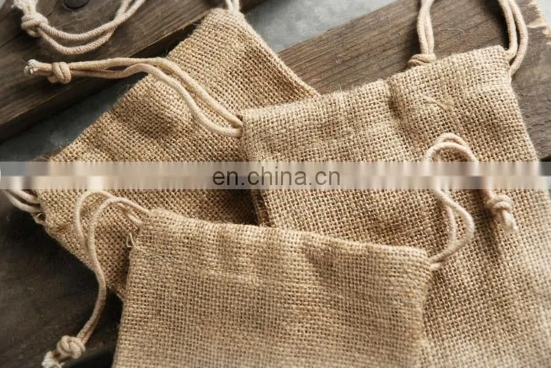promotional jute wine drawstring bag with paper tag tied on the drawstring
