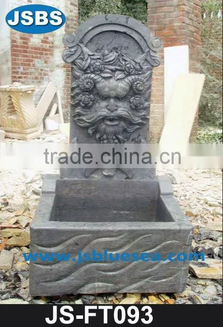 White marble wall fountain with angel