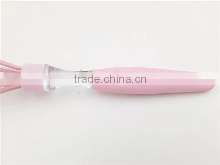 Pink silicone whisk