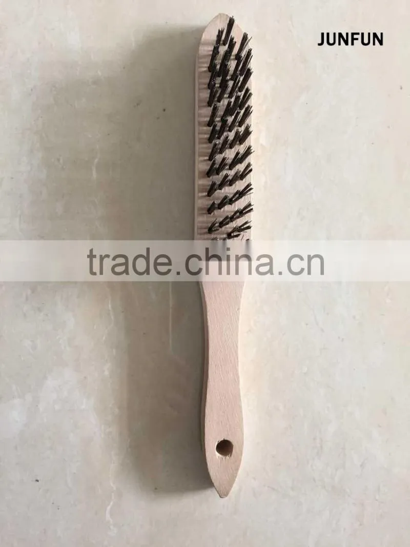 different rows wooden handle black steel wire brush