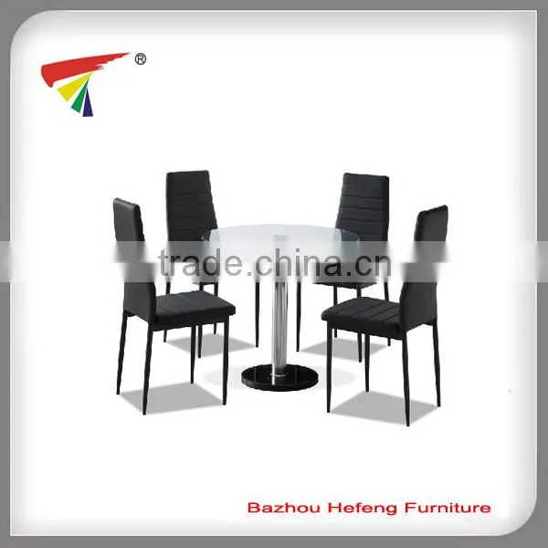 Black base clear glass top dining table
