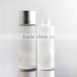 round glass lotion bottle with silver cap