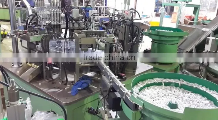 cosmetic plastic dispenser part assembly and test machine