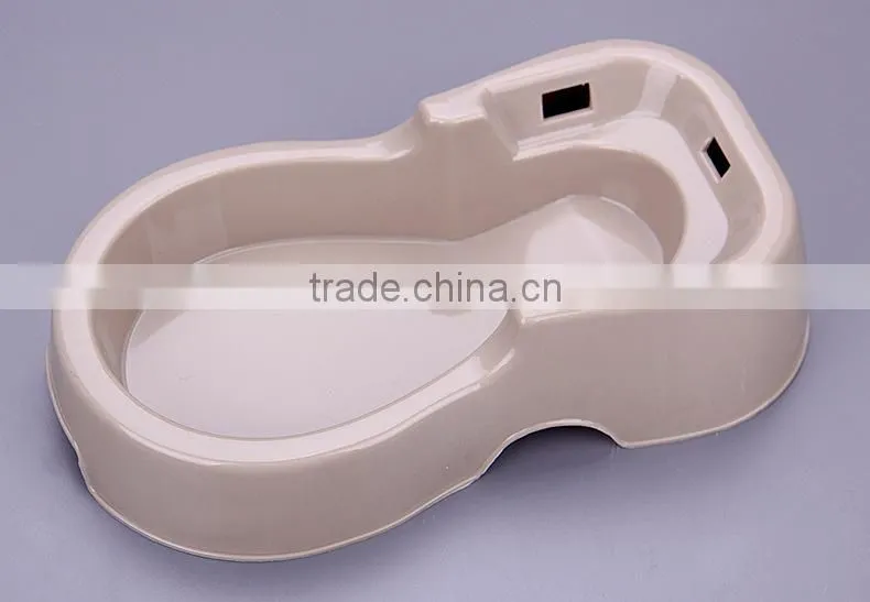 Pet dogs and cats sitting drinking fountain