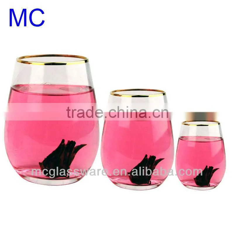 Hand blown clear water glass with gold rim