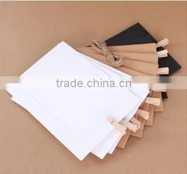 Recyclable paper picture photo frames hanging over at the rope with wood clamp