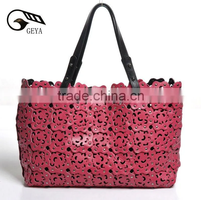 2012 fashion leather handbag ladies bag with punch flower patterns!
