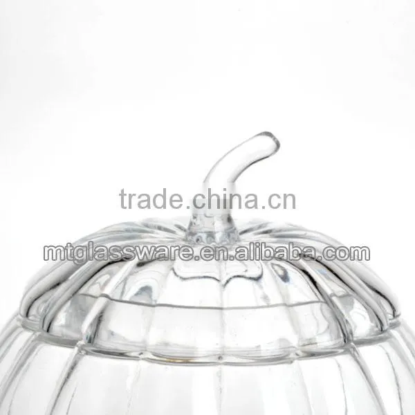 The shape of a pumpkin glass dispenser with metal stand