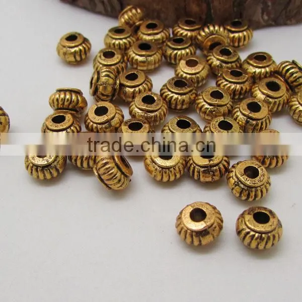 JS1228 Wholesale gold carved flower stardust rice beads,stardust drum spacer beads