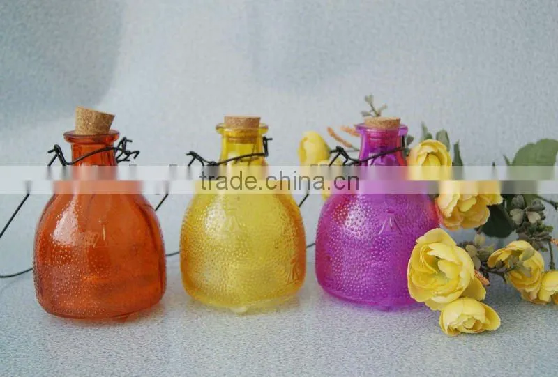 middle size colored glass wasp bottle
