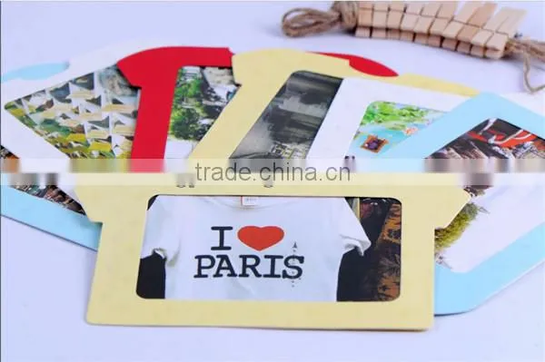 Recyclable paper picture photo frames hanging over at the rope with wood clamp