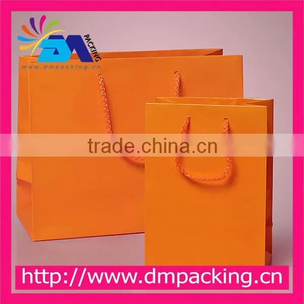 elegant pink clothing paper bag with handle for clothing shop