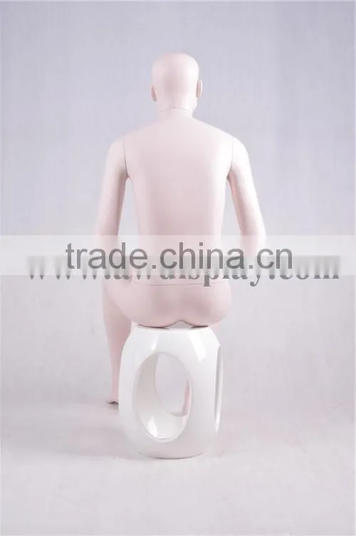 Realistic male mannequins in sitting pose