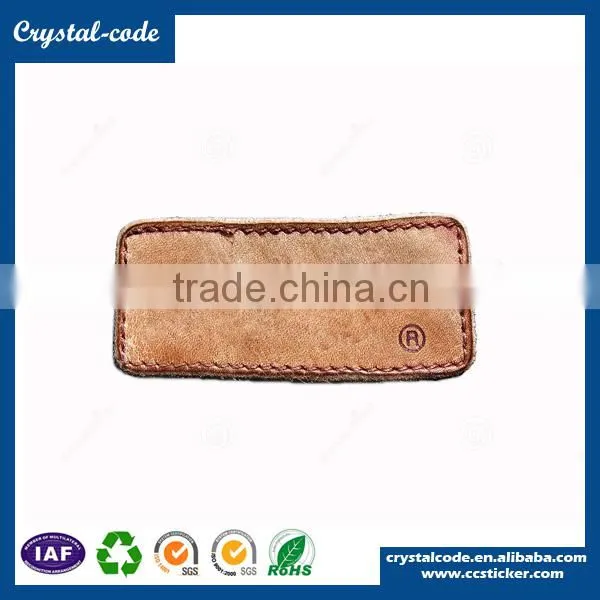 Custom embossed garment jeans faux leather label