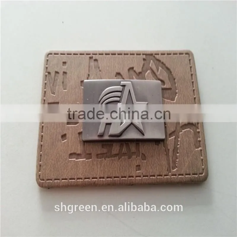 Embossed leather patch with metal logo for lady's handbag