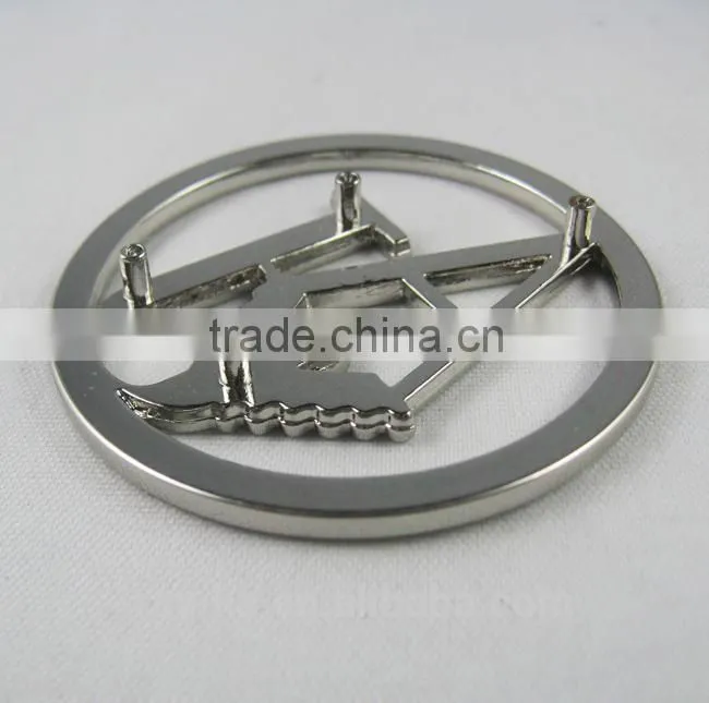 designer metal emblems handbag