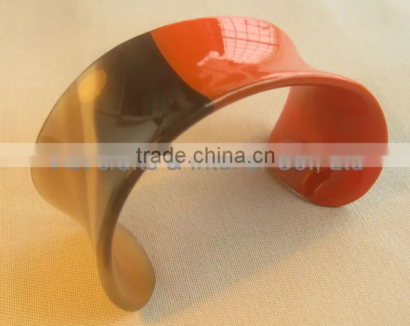 Buffalo horn cuff bracelet with half in orange lacquer